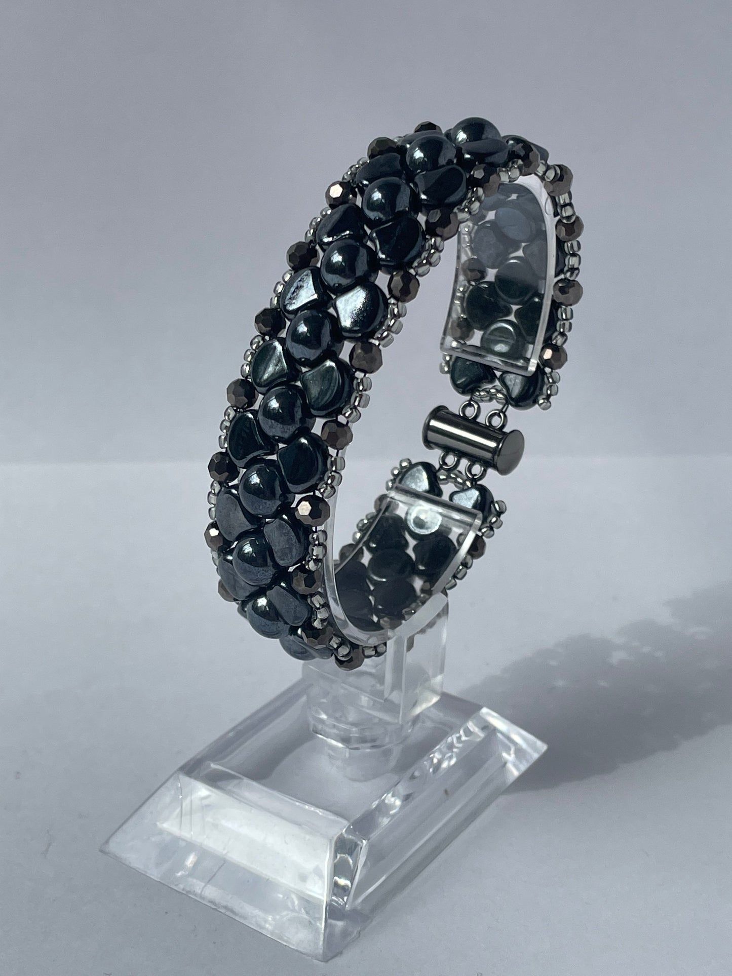 Close up image of bracelet on stand